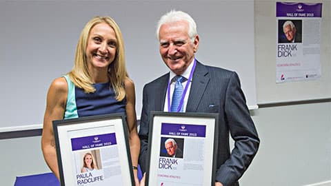 Paula Radcliffe holding Hall of Fame award in 2015 along with Frank Dick OBE.